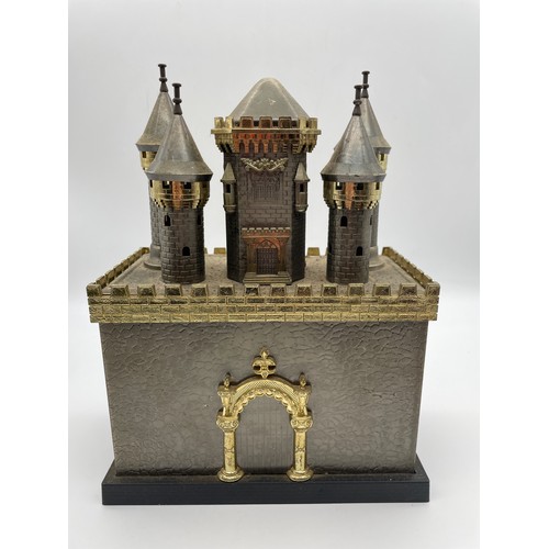 594 - NOVELTY CASTLE MUSICAL DECANTER SET