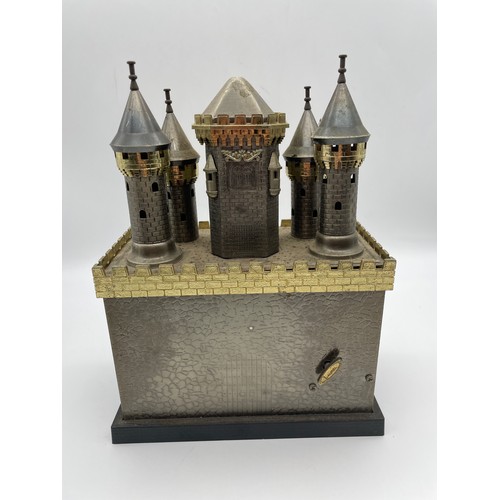 594 - NOVELTY CASTLE MUSICAL DECANTER SET