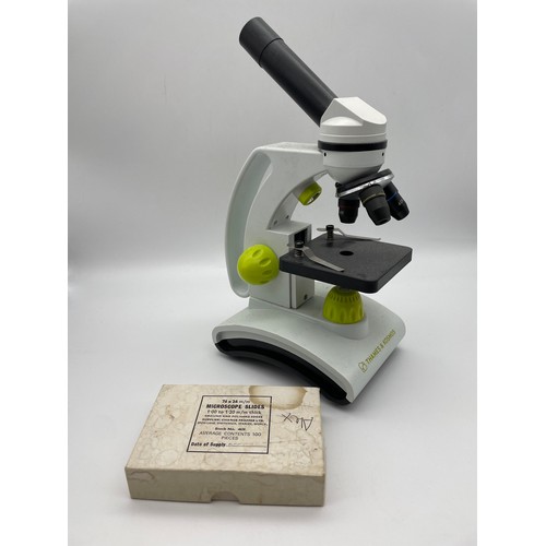 453 - THAMES AND COSMOS MICROSCOPE AND A BOX OF SINGLE GLASS SLIDES