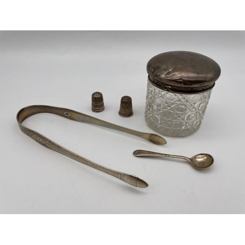 482 - BIRMINGHAM SILVER LIDED POWDER JAR, TWO THIMBLES, PAIR OF ENGRAVED SUGAR TONGS AND SPOON