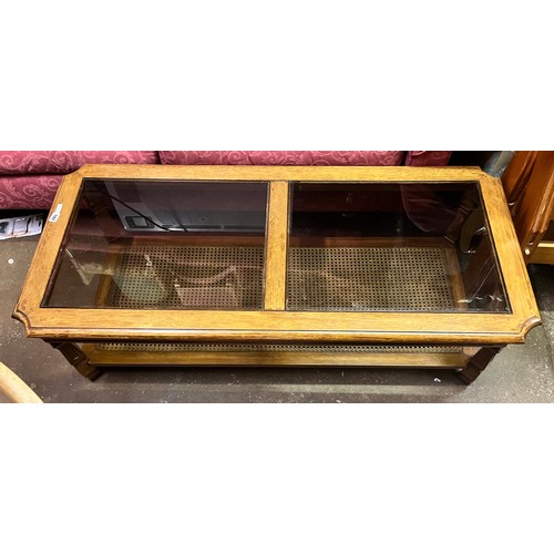 182 - WALNUT OBLONG COFFEE TABLE INSET GLASS TOP AND CANE UNDERTIER