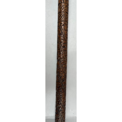 216 - INTERESTING CARVED WOODEN WALKING STICK DATED WITH NAME AND RELIGOUS TEXT (SANS HANDLE)