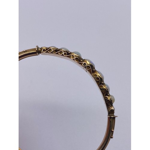 608 - 9CT NINE STONE OPAL BANGLE ON SAFETY CHAIN 9.4G OVERALL