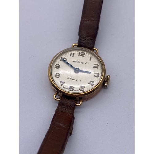 606 - LADIES 9CT GOLD CASED INGERSOLL WRIST WATCH ON LEATHER STRAP