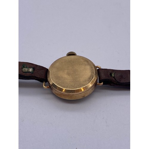 606 - LADIES 9CT GOLD CASED INGERSOLL WRIST WATCH ON LEATHER STRAP