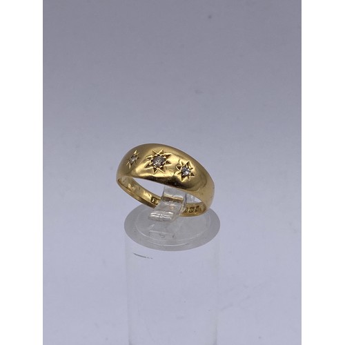 533 - 18CT GOLD RING WITH DIAMOND STARBURST DECORATION 3.8G APPROX. SIZE N