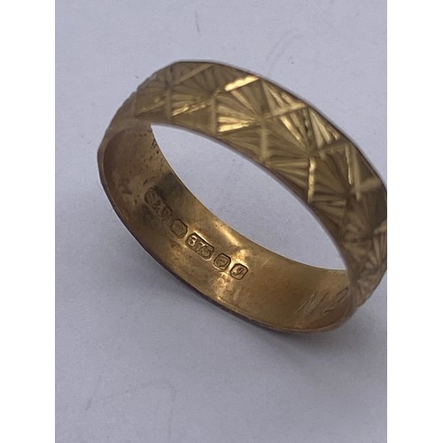 610 - 9CT GOLD WEDDING BAND AND A 9CT GOLD RING WITH BRIGHT CUT DECORATION 3G APPROX. SIZE M AND R