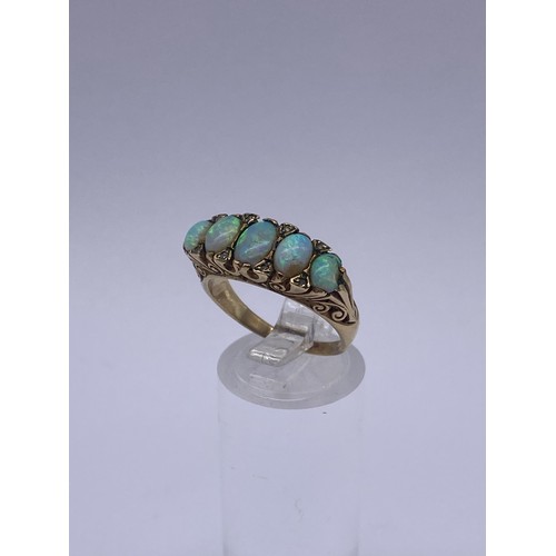 609 - 9CT FIVE STONE OPAL AND DIAMOND CHIP RING 5.6G OVERALL SIZE O