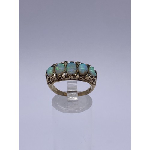 609 - 9CT FIVE STONE OPAL AND DIAMOND CHIP RING 5.6G OVERALL SIZE O