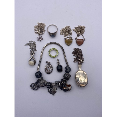 544 - SMALL SELECTION OF SILVER JEWELLERY INCLUDING CHARM BRACELET, LOCKETS, NECKLACES ETC.