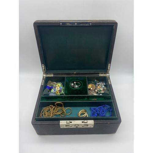 599 - LEATHER JEWELLERY BOX WITH GREEN INTERIOR CONTAINING FLORAL ENCRUSTED BROOCH AND EARRINGS, CHAINS AN... 