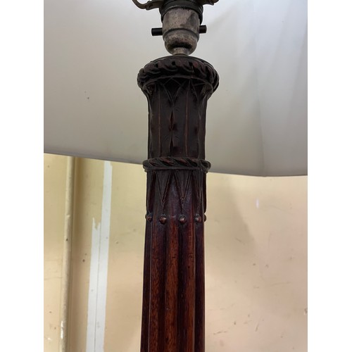 17 - FLUTED CARVED AND REEDED MAHOGANY LAMP STANDARD ON TRIFORM BASE