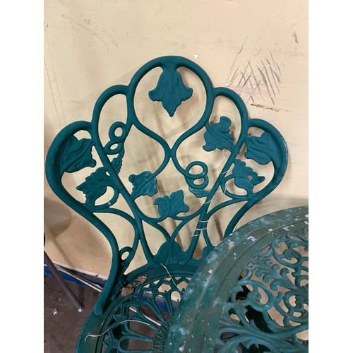 47 - GREEN VICTORIAN STYLE WROUGHT IRON PATIO TABLE AND PAIR OF CHAIRS