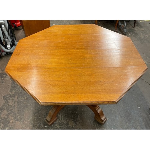 64 - EDWARDIAN OAK OCTAGONAL TOPPED PEDESTAL CENTRE TABLE