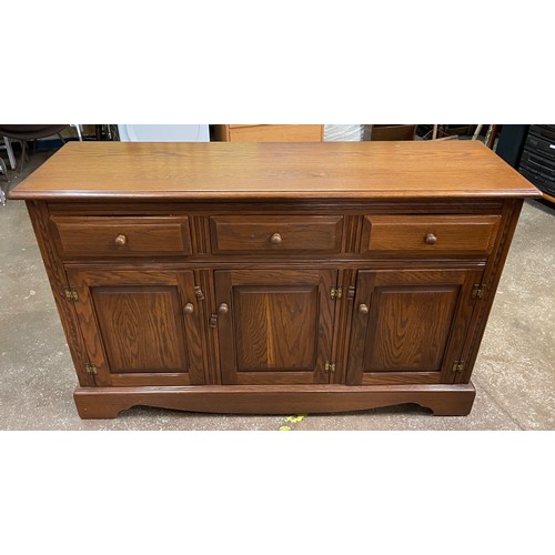 93 - JAYCEE OAK THREE DOOR DRESSER BASE