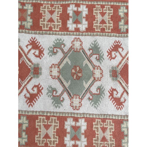 235 - 20TH CENTURY CARPET RUNNER WITH LOZENGE AND GEOMETRIC PATTERNS 86CM X 136CM APPROX