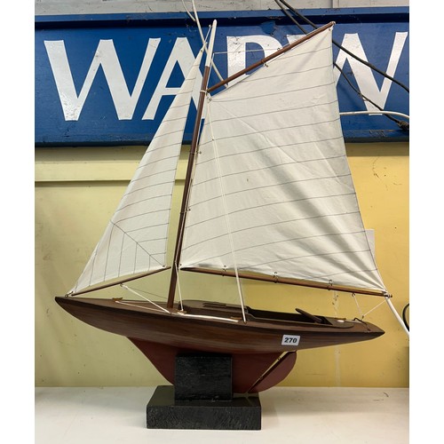 220 - TWO MASTED MODEL OF A  YACHT ON STAND