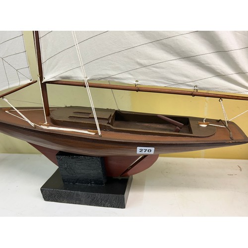 220 - TWO MASTED MODEL OF A  YACHT ON STAND