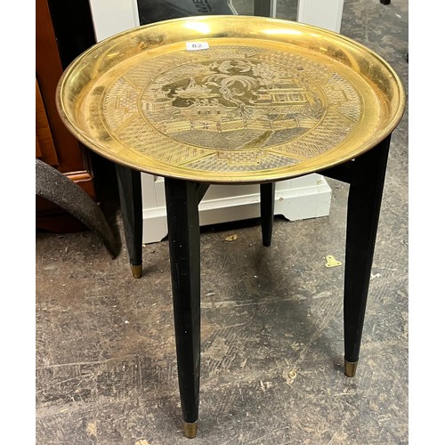 82 - BRASS ENGRAVED TRAY TOP TABLE ON FOLDING STAND