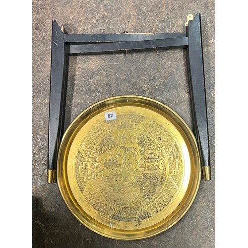 82 - BRASS ENGRAVED TRAY TOP TABLE ON FOLDING STAND