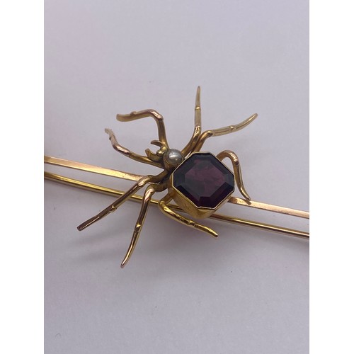 765 - 9CT ROSE AND YELLOW GOLD SPIDER BAR BROOCH INSET WITH AMETHYST AND PEARL WITH SAFETY CHAIN 6.5G OVER... 