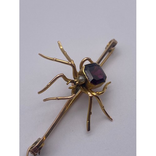 765 - 9CT ROSE AND YELLOW GOLD SPIDER BAR BROOCH INSET WITH AMETHYST AND PEARL WITH SAFETY CHAIN 6.5G OVER... 