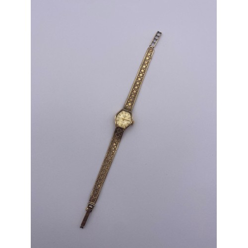 766 - 9CT LADIES MARVIN REVIEW QUARTZ WRISTWATCH ON TEXTURED LATTICE STRAP 16.7G OVERALL APPROX