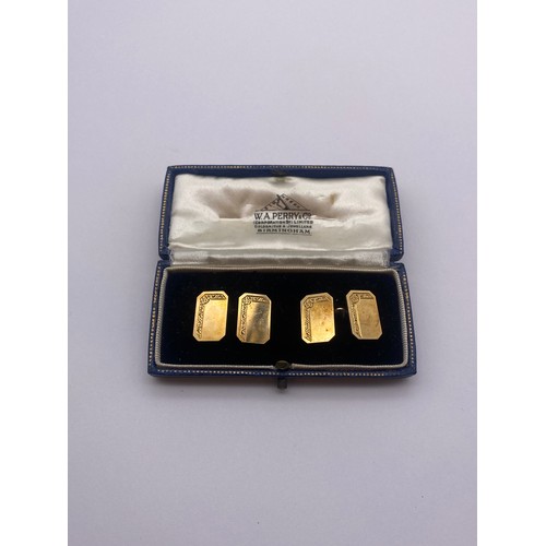 784 - BOXED PAIR OF 9CT GOLD RECTANGULAR CUFF LINKS WITH CANTED EDGES AND ENGRAVED DECORATION 8.9G APPROX