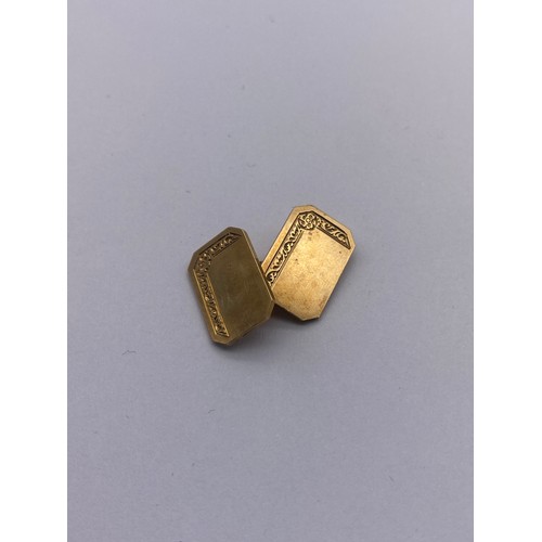 784 - BOXED PAIR OF 9CT GOLD RECTANGULAR CUFF LINKS WITH CANTED EDGES AND ENGRAVED DECORATION 8.9G APPROX