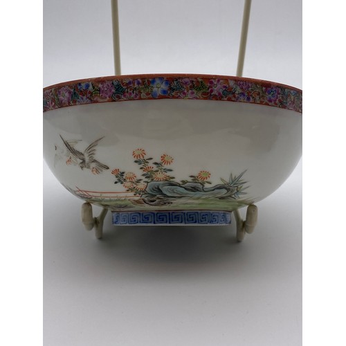 713 - CHINESE EXPORT PORCELAIN SHALLOW BOWL DECORATED WITH BIRDS IN GARDEN LANDSCAPE WITH MILLE FLEUR INTE... 