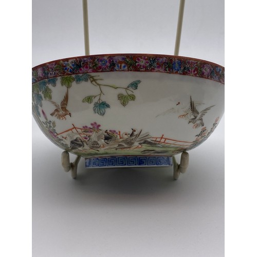 713 - CHINESE EXPORT PORCELAIN SHALLOW BOWL DECORATED WITH BIRDS IN GARDEN LANDSCAPE WITH MILLE FLEUR INTE... 