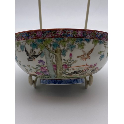 713 - CHINESE EXPORT PORCELAIN SHALLOW BOWL DECORATED WITH BIRDS IN GARDEN LANDSCAPE WITH MILLE FLEUR INTE... 