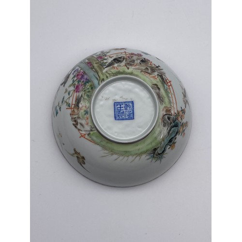 713 - CHINESE EXPORT PORCELAIN SHALLOW BOWL DECORATED WITH BIRDS IN GARDEN LANDSCAPE WITH MILLE FLEUR INTE... 