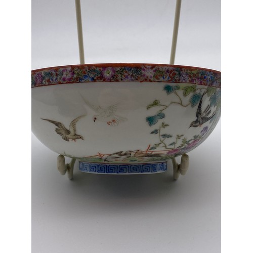 713 - CHINESE EXPORT PORCELAIN SHALLOW BOWL DECORATED WITH BIRDS IN GARDEN LANDSCAPE WITH MILLE FLEUR INTE... 