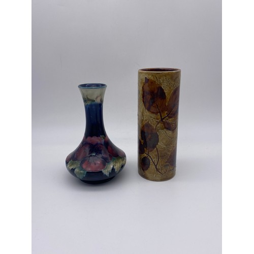 710 - ROYAL DOULTON CYLINDRICAL AUTUMN LEAVES VASE AND A MOORCROFT PANSY TAPERED VASE A/F