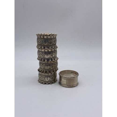 671 - SET OF FOUR BIRMINGHAM CRIMPED EDGE NAPKIN RINGS AND BOXED SINGLE NAPKIN RING WITH ENGINE TURNED DEC... 