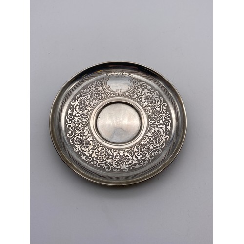 660 - 800 WHITE METAL ENGRAVED CUP AND SAUCER