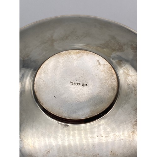 660 - 800 WHITE METAL ENGRAVED CUP AND SAUCER