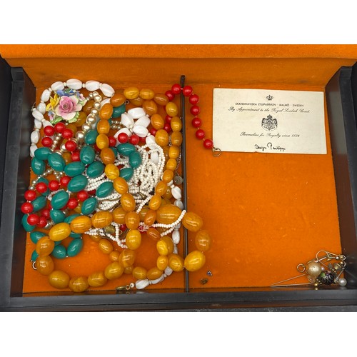 773 - BOX CONTAINING COSTUME JEWELLERY INCLUDING PLATED NECK CHAINS, BROOCHES, CHARM BRACELET, BEADS