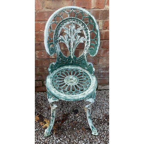 51 - VICTORIAN STYLE CAST IRON CIRCULAR PATIO TABLE AND TWO CHAIRS