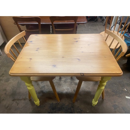 66 - PINE TOPPED YELLOW PAINTED VICTORIAN STYLE KITCHEN TABLE AND FOUR STICK BACK CHAIRS