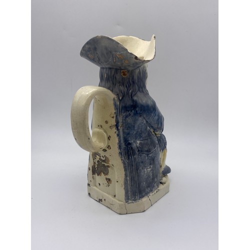 313 - 19TH CENTURY POTTERY SEATED TOBY JUG A/F