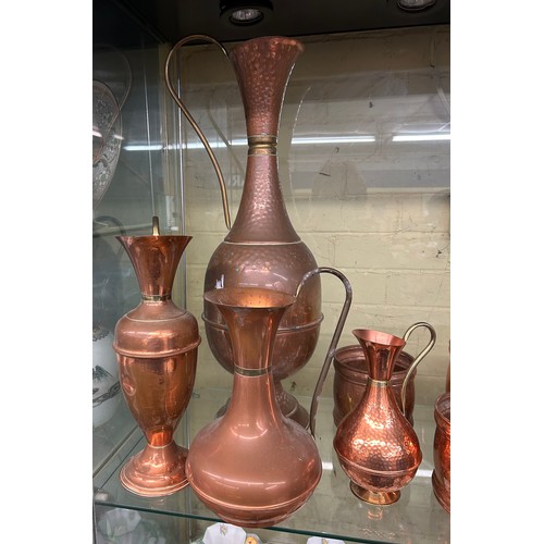 293 - SHELF OF DECORATIVE COPPER EWER VASES AND PLANTERS