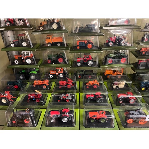 276 - LARGE SELECTION BLISTER PACKED COLLECTION OF MODEL TRACTORS AND FARM VEHICLES WITH ACCOMPANYING MAGA... 