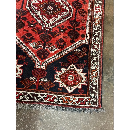 72 - EARLY 20TH CENTURY CAUCASIAN FRINGE CARPET WITH GEOMETRIC PATTERNS