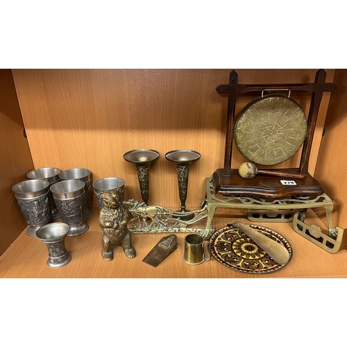 279 - BRASS AND WOODEN SERVING GONG, BRASS TRIVET, STANDING BEAR MONEY BOX AND PEWTER BAS RELIEF GOBLETS