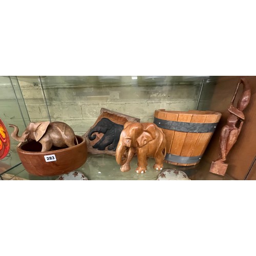 283 - CARVED ELEPHANT FIGURES, BOWLS AND PLANTER