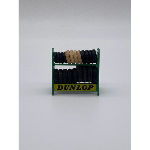 584 - DIE CAST DINKY TOYS - DUNLOP TYRE RACK