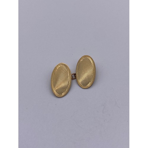 449 - PAIR OF GENTLEMANS OVAL ENGINE TURNED 9CT GOLD CUFF LINKS 6.7G APPROX