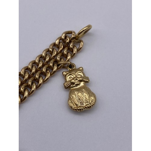 436 - 9CT GOLD FLAT CURB LINK CHARM BRACELET WITH SWIVEL FASTENER INCLUDING A GEORGE V 1913 HALF SOVEREIGN... 